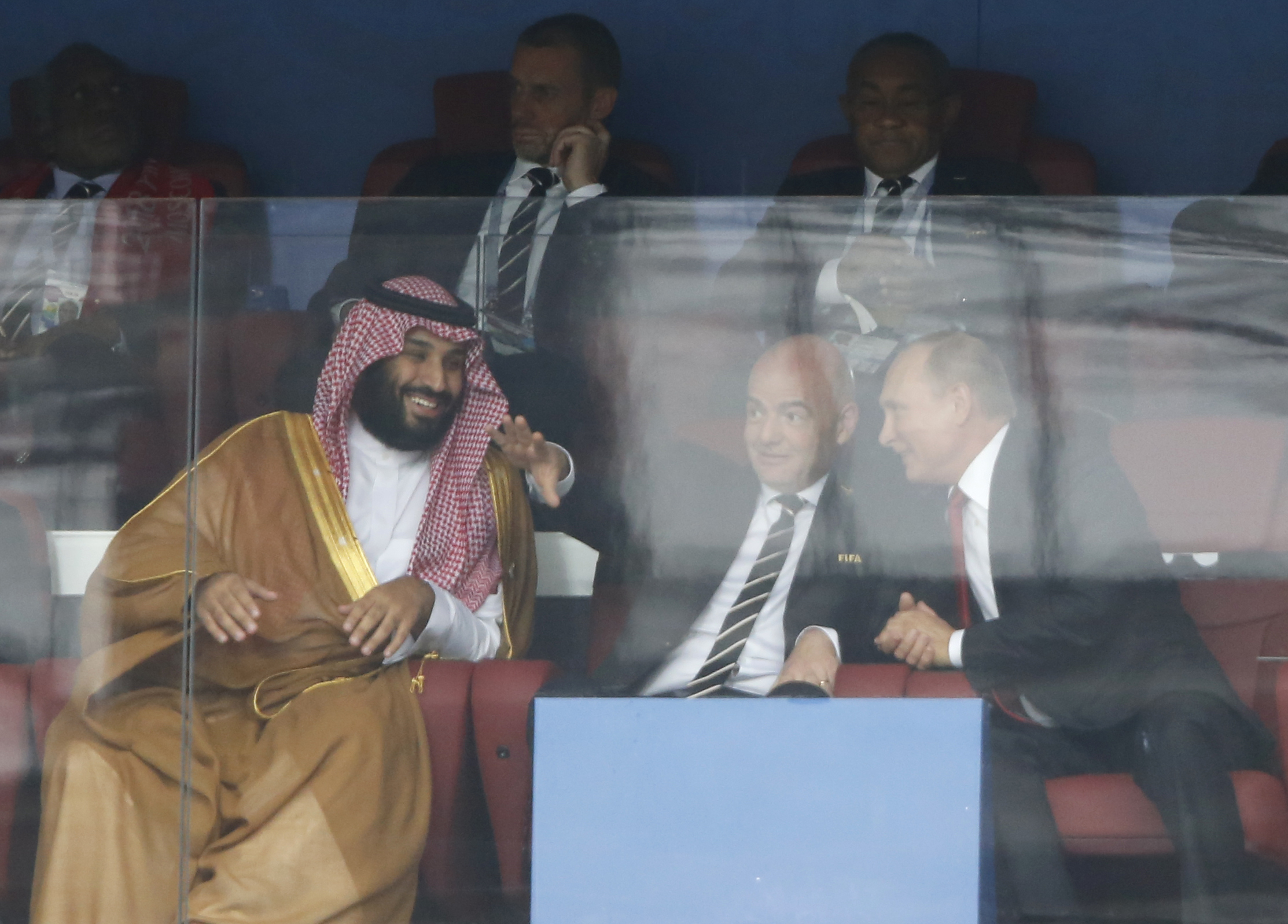FILE - Saudi Arabia Crown Prince Mohammed bin Salman, left, FIFA President Gianni Infantino, center, and Russian President Vladimir Putin watch the match between Russia and Saudi Arabia which opens the 2018 soccer World Cup at the Luzhniki stadium in Moscow, Russia, on June 14, 2018. If Saudi Arabia could have designed a process for choosing future World Cup hosts, it might look similar to what FIFA unveiled for the 2030 and 2034 men’s soccer tournaments. The Saudi Arabian soccer federation became the favored candidate to host in 2034. (AP Photo/Hassan Ammar, File)