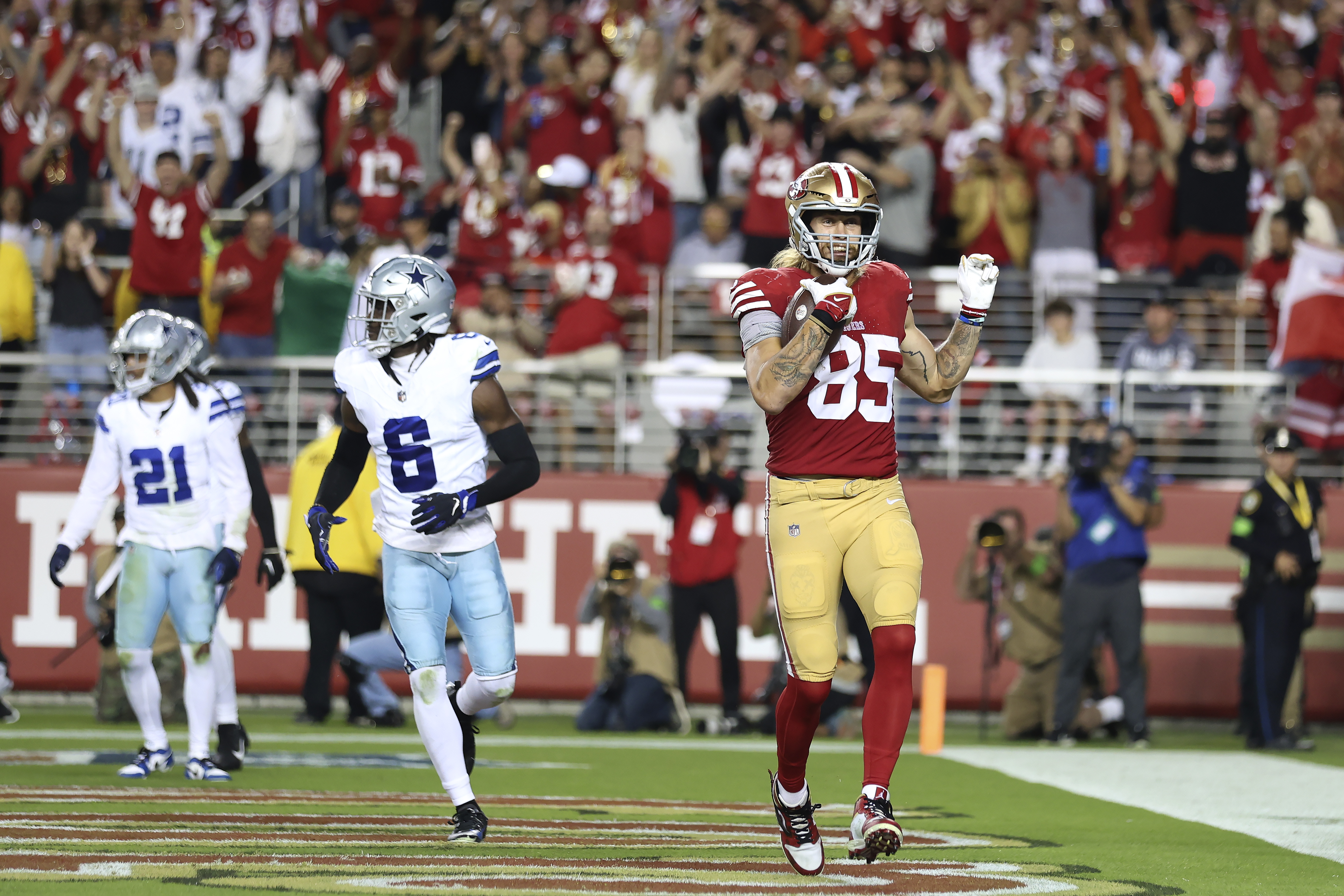 San Francisco 49ers tight end George Kittle (85) celebrates after catching a touchdown pass against the Dallas Cowboys during the second half of an NFL football game in Santa Clara, Calif., Sunday, Oct. 8, 2023. (AP Photo/Jed Jacobsohn)